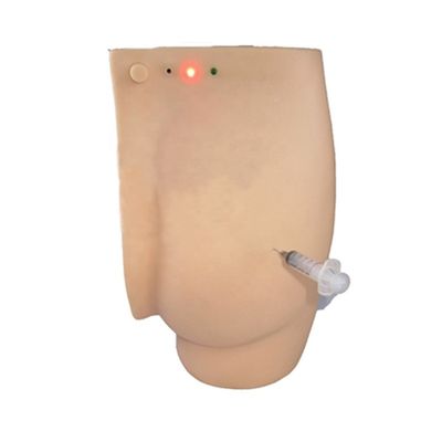 Dimostrazione di cura dei pazienti glutei Iniezione Simulatore didattico con luci di avvertimento